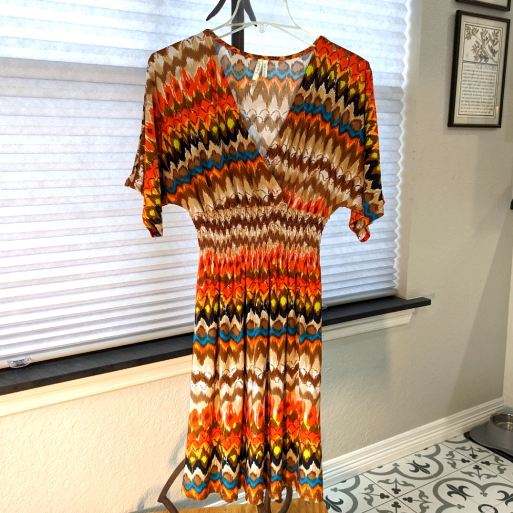 Gently used Cristinalove, size large, smocked waste dress